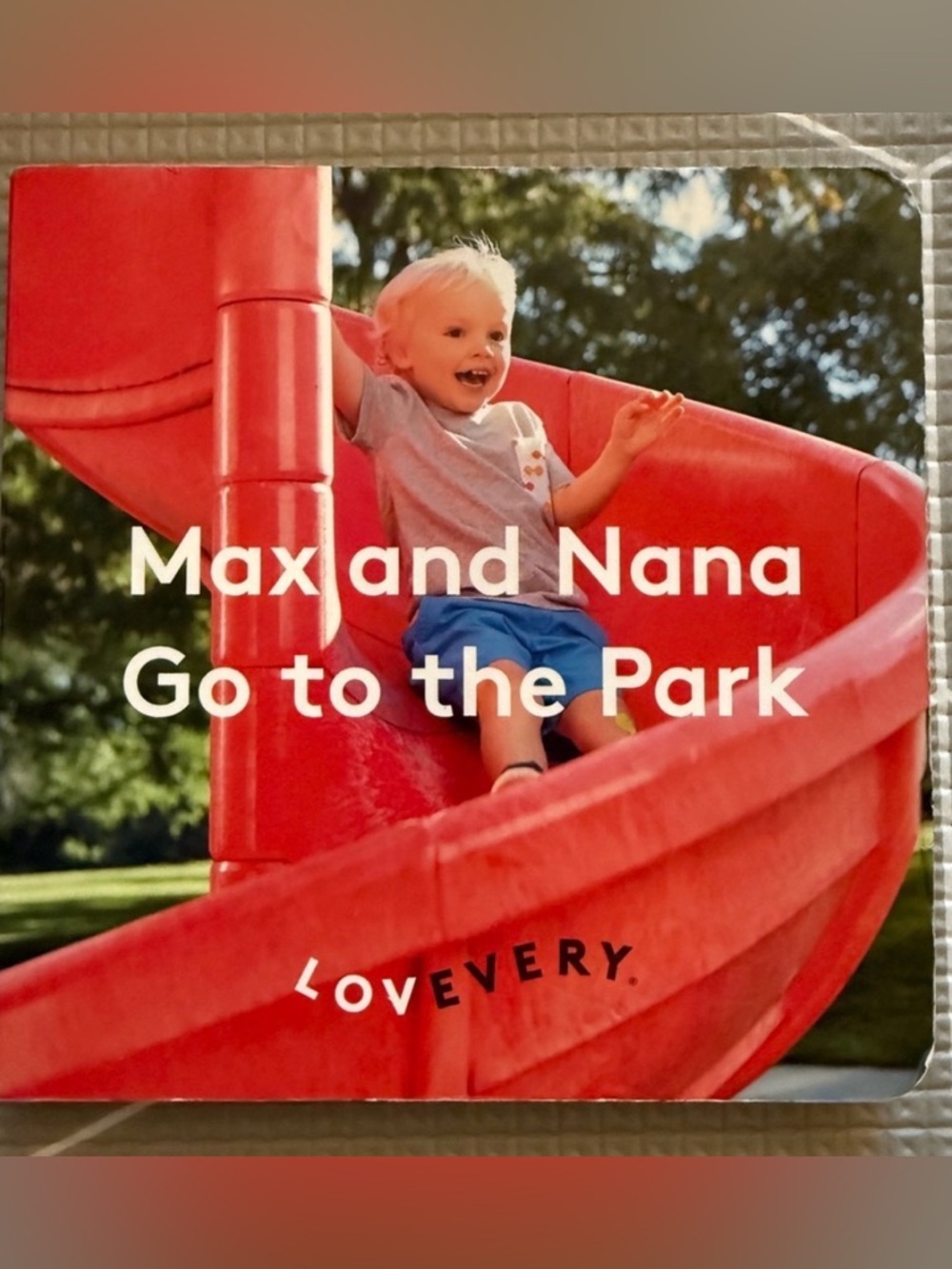 Lovevery "Max and Nana Go to the Park" Board Book - Red Slide Cover